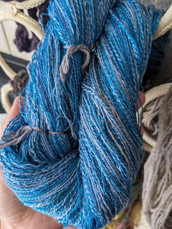 a hank of blue handspun silk yarn